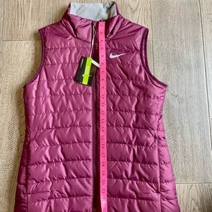 NWT, Nike Golf wind proof vest with front pockets. Purple, with grey accents.